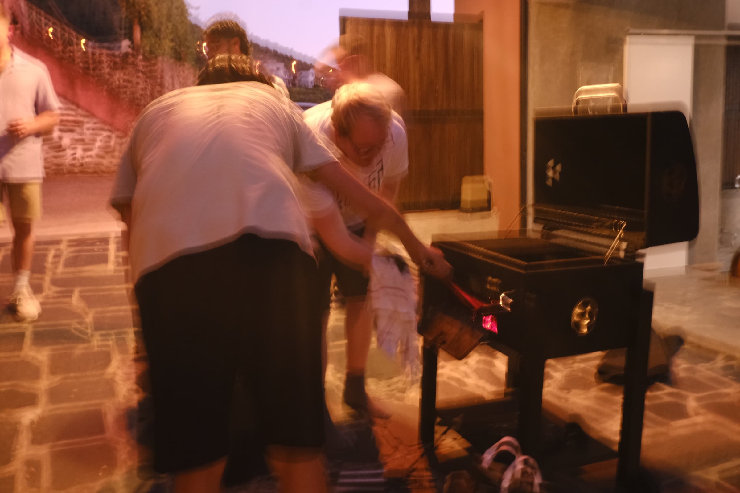 Null Studios team gathered around an outdoor fire